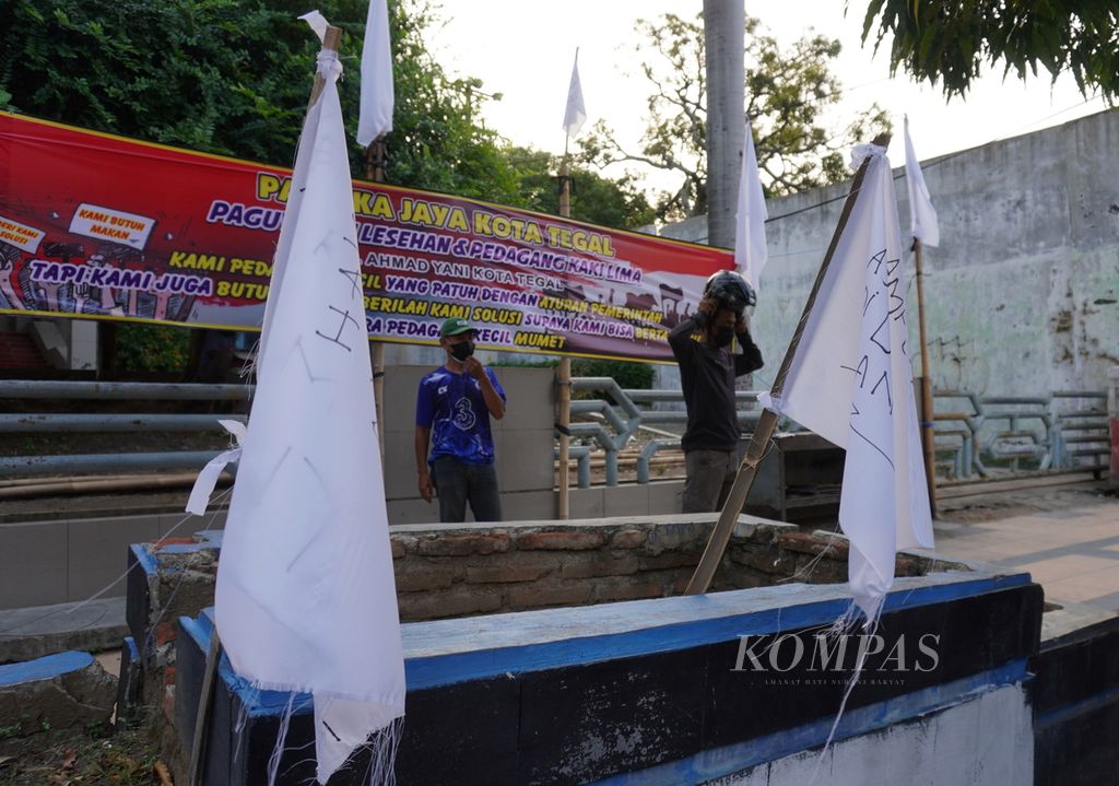 https://assetd.kompas.id/9oYQdxwOH7xMiVjsWjmly_TUl9U=/1024x719/filters:watermark(https://cdn-content.kompas.id/umum/kompas_main_logo.png,-16p,-13p,0)/https%3A%2F%2Fkompas.id%2Fwp-content%2Fuploads%2F2021%2F07%2F029c7099-35bb-476b-b2ab-dc77612263df_jpg.jpg