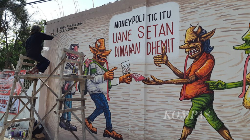 https://assetd.kompas.id/J5eq33GYxJmTWKMILoM73sfsdZg=/1024x576/filters:watermark(https://cdn-content.kompas.id/umum/kompas_main_logo.png,-16p,-13p,0)/https%3A%2F%2Fkompas.id%2Fwp-content%2Fuploads%2F2020%2F08%2F20200819nik-foto-mural-pilkada4_1597827563.jpg