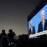 Tombol Pembisu yang Menekan Agresivitas Trump